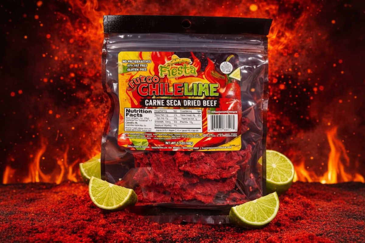 A package of Fiesta Fuego Chile Lime Carne Seca Dried Beef, shown in a clear resealable bag with a colorful label, surrounded by lime wedges and red seasoning on a fiery red background.